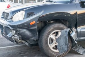 Vehicle Hits Building, Hurts Two Near Center St